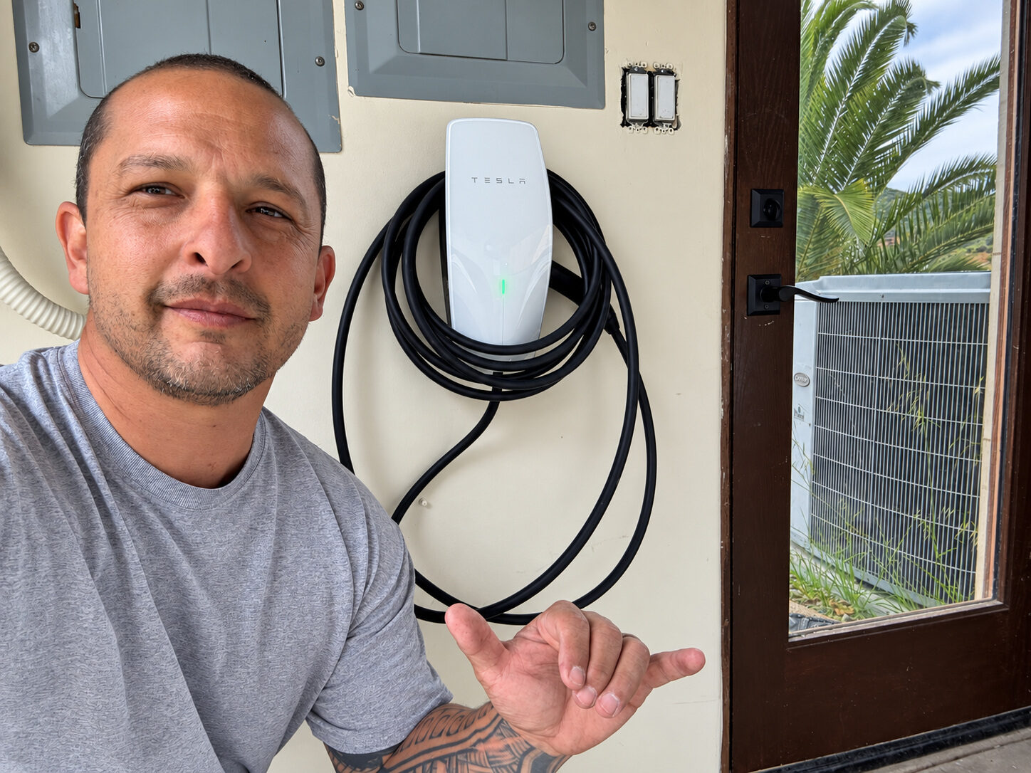 LTBL Energy technician completing a Tesla Wall Connector installation